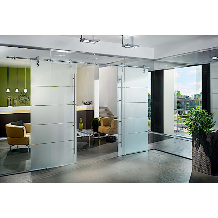 MANET sliding glass doors with single-point fixings in hotel interior